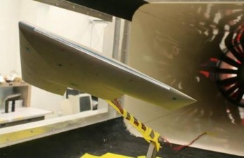 A flying wing type airfoil shown in a wind tunnel.